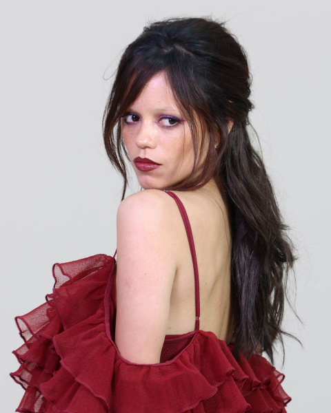 dark romance makeup trend 2026 jenna ortega with bold red lip and dark shadow