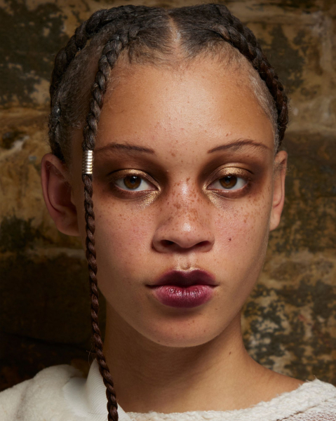 dark romance makeup trend 2026 model with blurred berry lips